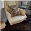 F59. Yellow wingback chair. 